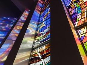 Closeup low angle of the stained glass panels in the LTSS chapel with the dove visible